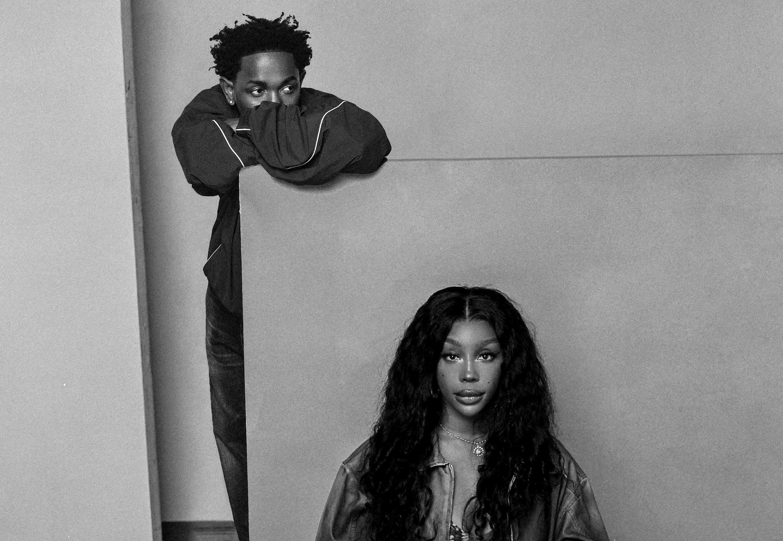 Kendrick Lamar leaning over a grey partition above SZA, seated, in a black-and-white portrait